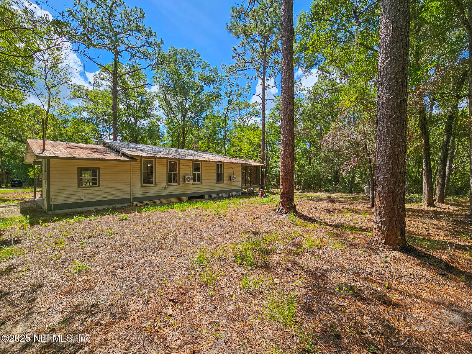125 Lemon Street, Unit 22 Melrose, FL 32666 - Photo 23 of 28 a view of a house with a yard