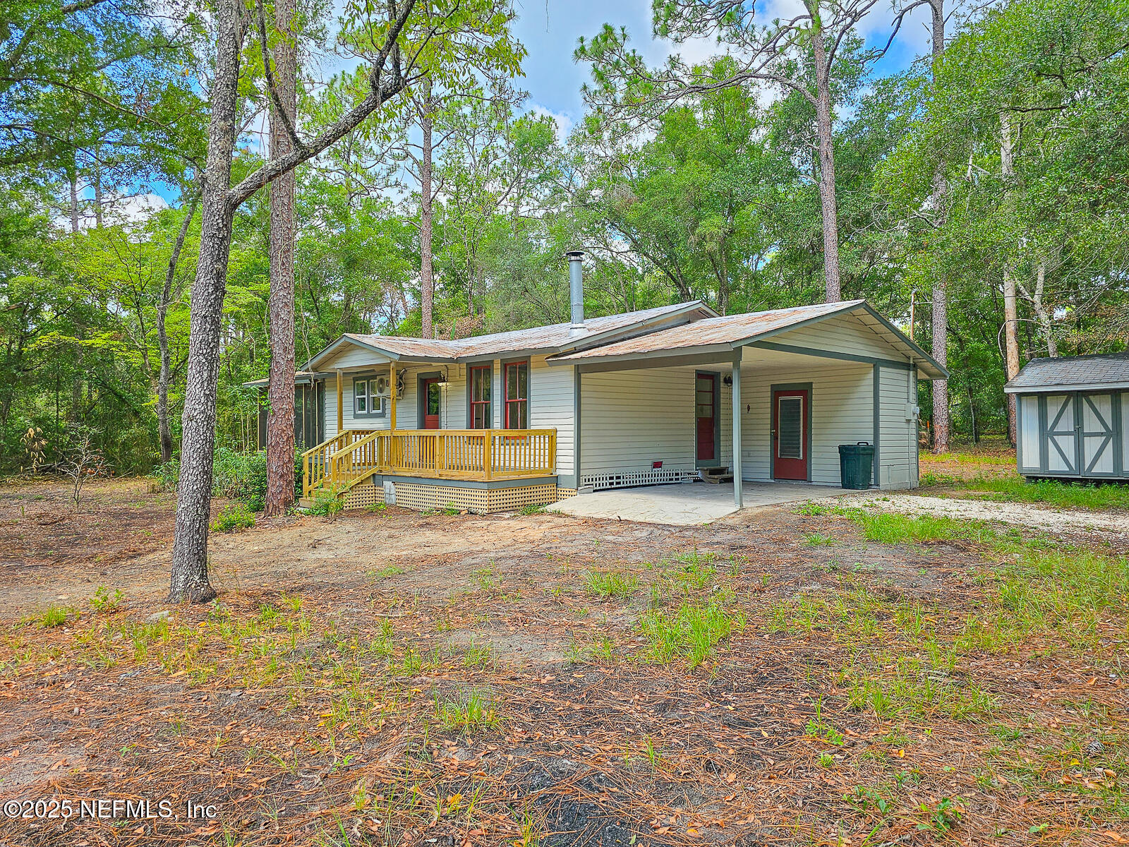 125 Lemon Street, Unit 22 Melrose, FL 32666 - Photo 3 of 28 front view of a house with a yard