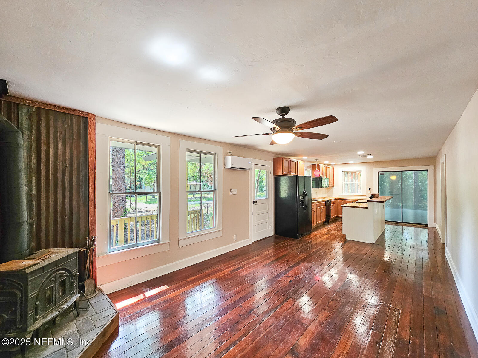 125 Lemon Street, Unit 22 Melrose, FL 32666 - Photo 5 of 28 a view of a livingroom with furniture wooden floor and window