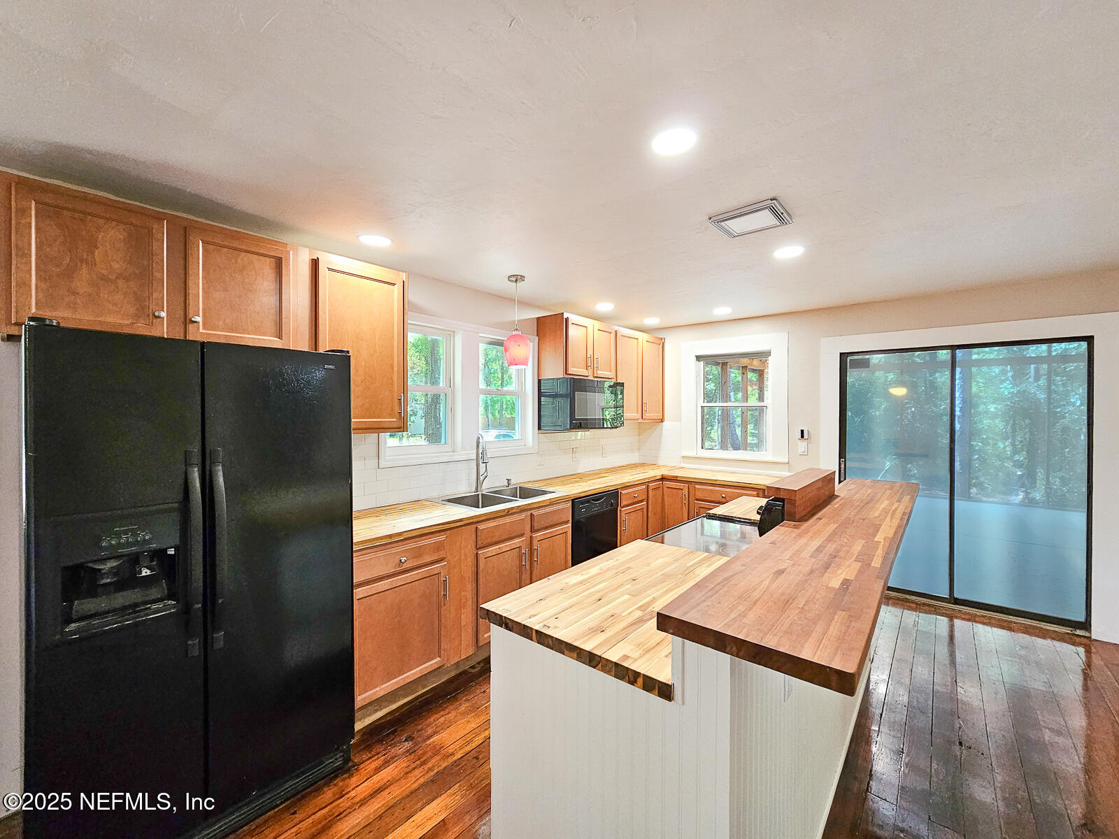 125 Lemon Street, Unit 22 Melrose, FL 32666 - Photo 9 of 28 a kitchen with stainless steel appliances granite countertop a refrigerator and a sink