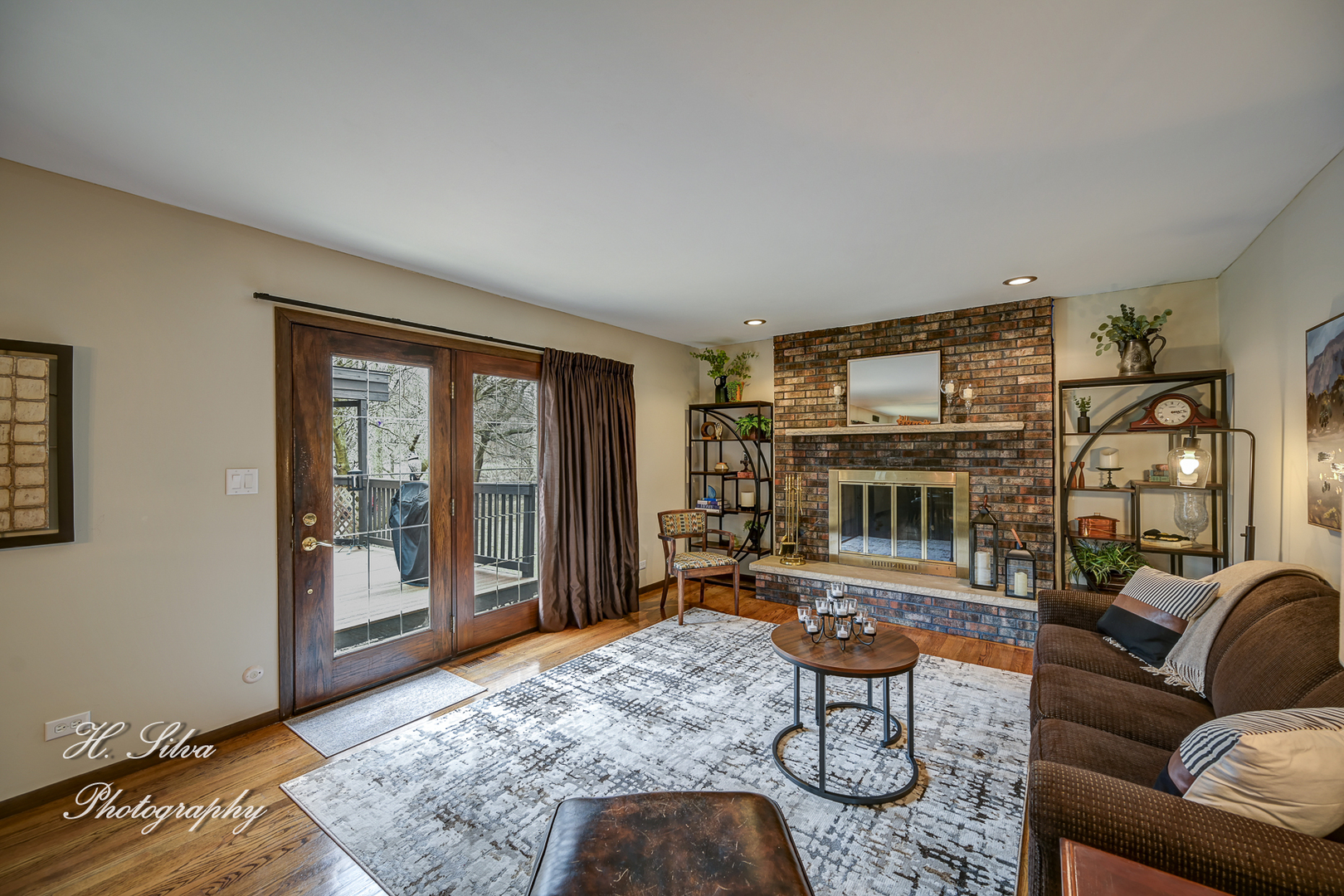 1402 Winaki Trail Algonquin, IL 60102 - Photo 13 of 33 a living room with furniture a fireplace and a table