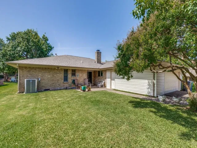 a front view of house with yard and seating area