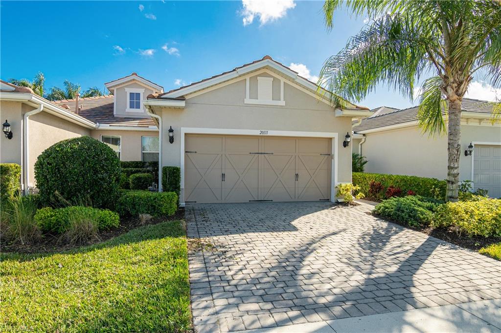 20111 Torch Key Way Estero, FL 33928 - Photo 1 of 29 a front view of a house with a yard