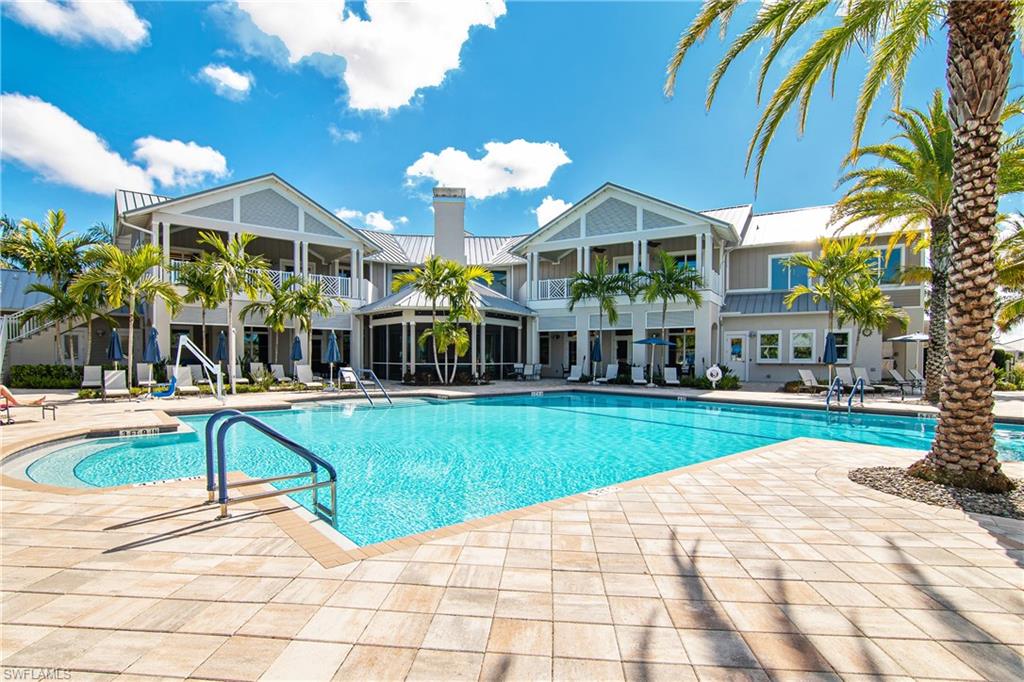 20111 Torch Key Way Estero, FL 33928 - Photo 16 of 29 a view of a house with a swimming pool