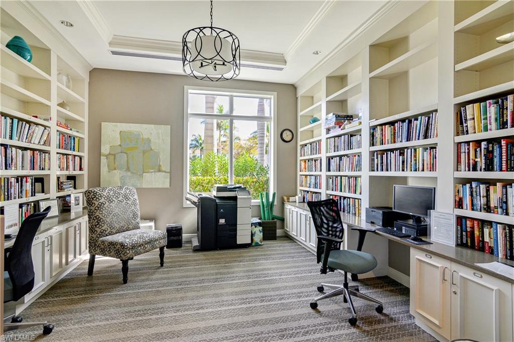 20111 Torch Key Way Estero, FL 33928 - Photo 25 of 29 a view of a livingroom with workspace and a bookshelf