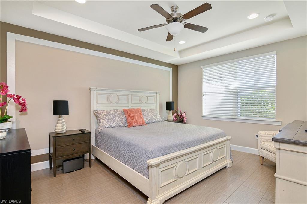 20111 Torch Key Way Estero, FL 33928 - Photo 5 of 29 a bedroom with a bed and a window