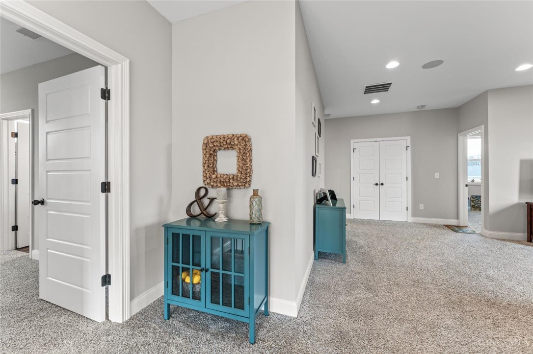 2425 Middleboro Road Clarksville, OH 45113 - Photo 55 of 91 This interior hallway features neutral tones and plush carpeting, creating an inviting atmosphere.
