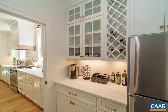 a kitchen with a sink and a refrigerator