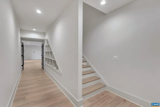 a view of a hallway with stairs