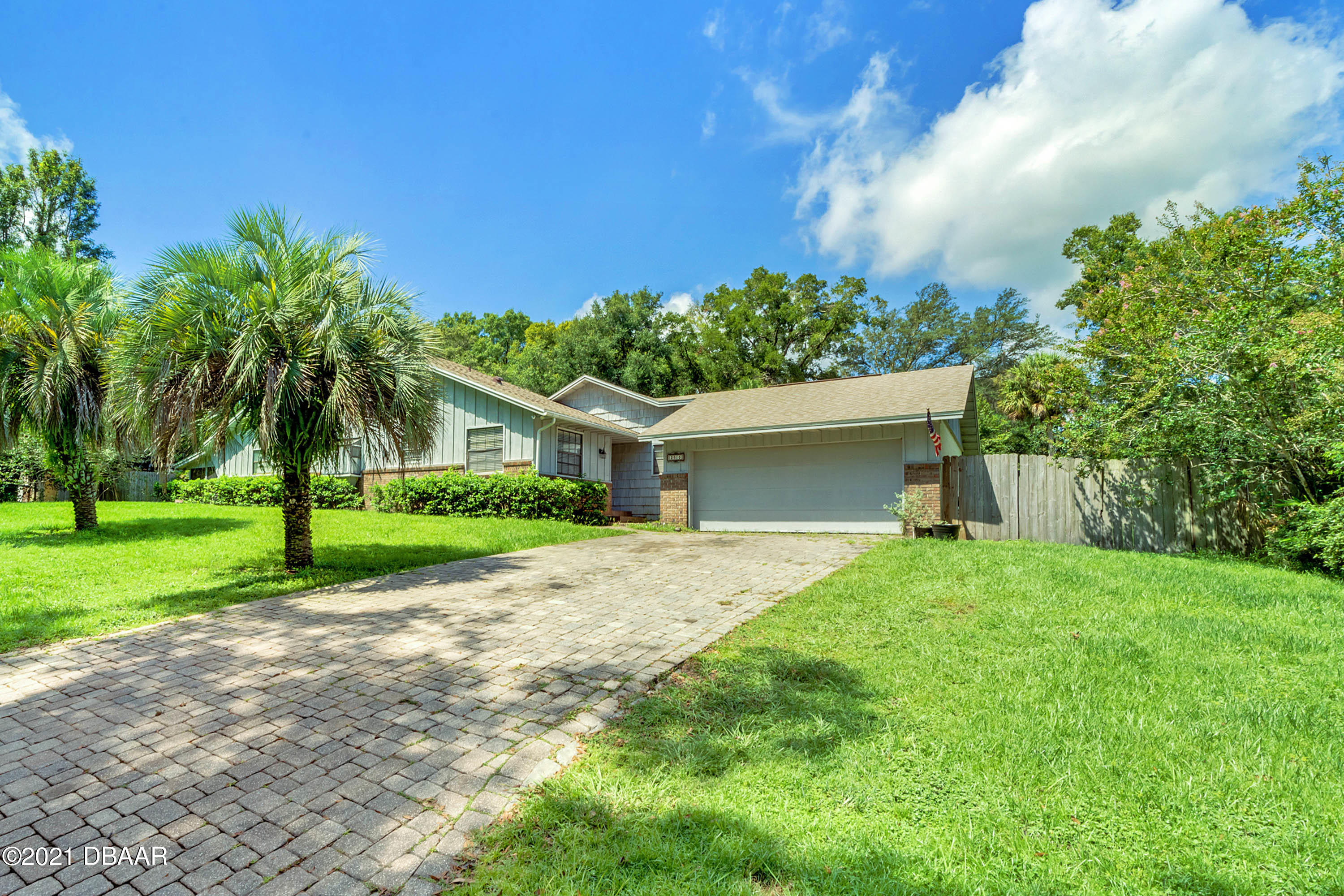 2815 Concord Road DeLand, FL 32720 - Photo 1 of 29 a view of a house with palm trees