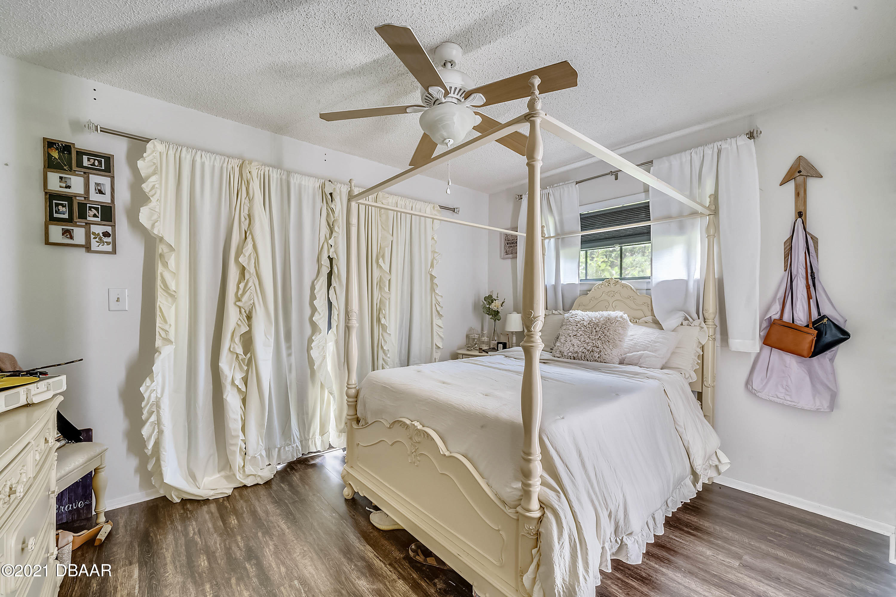 2815 Concord Road DeLand, FL 32720 - Photo 14 of 29 a bedroom with a bed and wooden floor