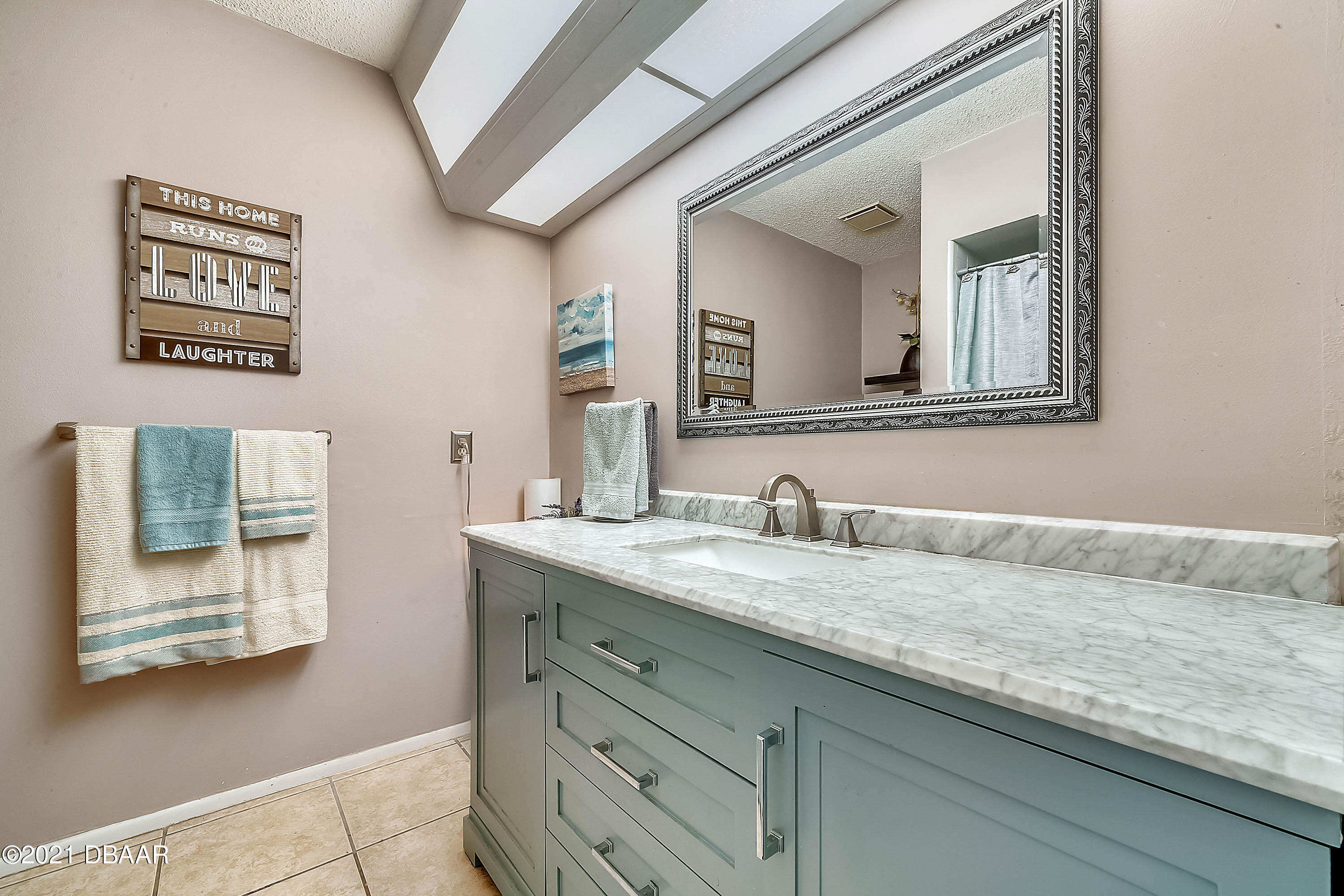 2815 Concord Road DeLand, FL 32720 - Photo 20 of 29 a bathroom with a granite countertop sink and a mirror