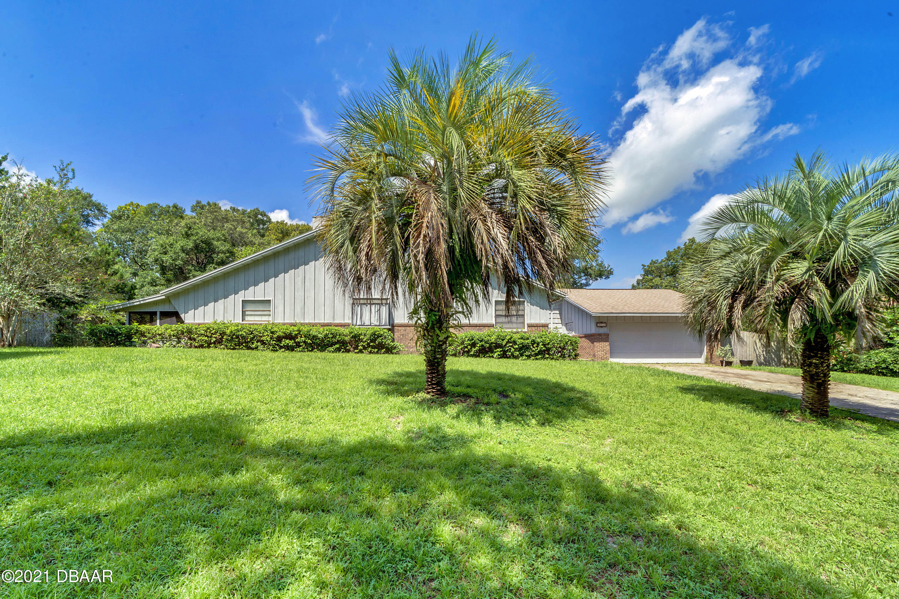 2815 Concord Road DeLand, FL 32720 - Photo 2 of 29 a blue house with pool in front of it