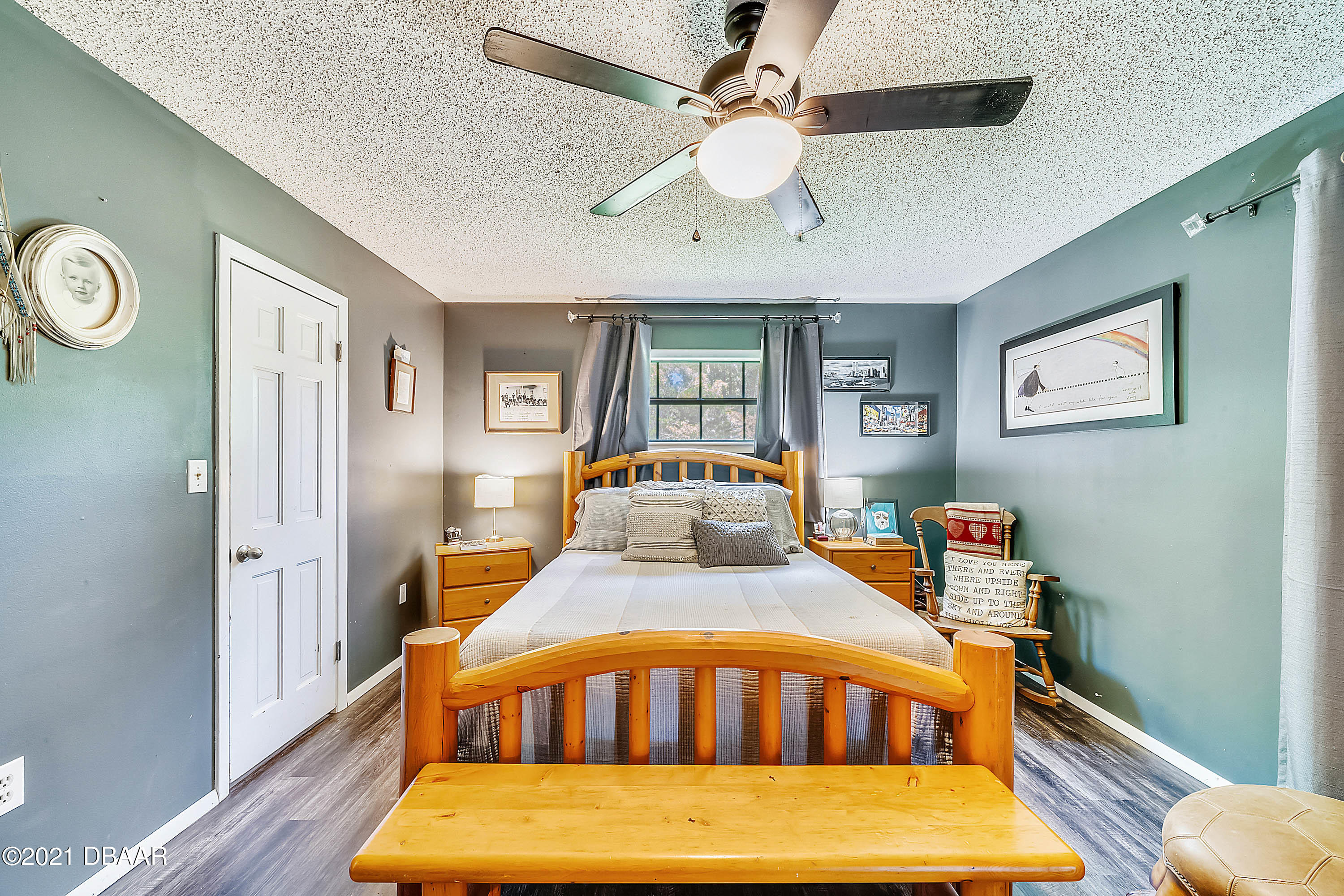 2815 Concord Road DeLand, FL 32720 - Photo 22 of 29 a bedroom with a bed and wooden floor