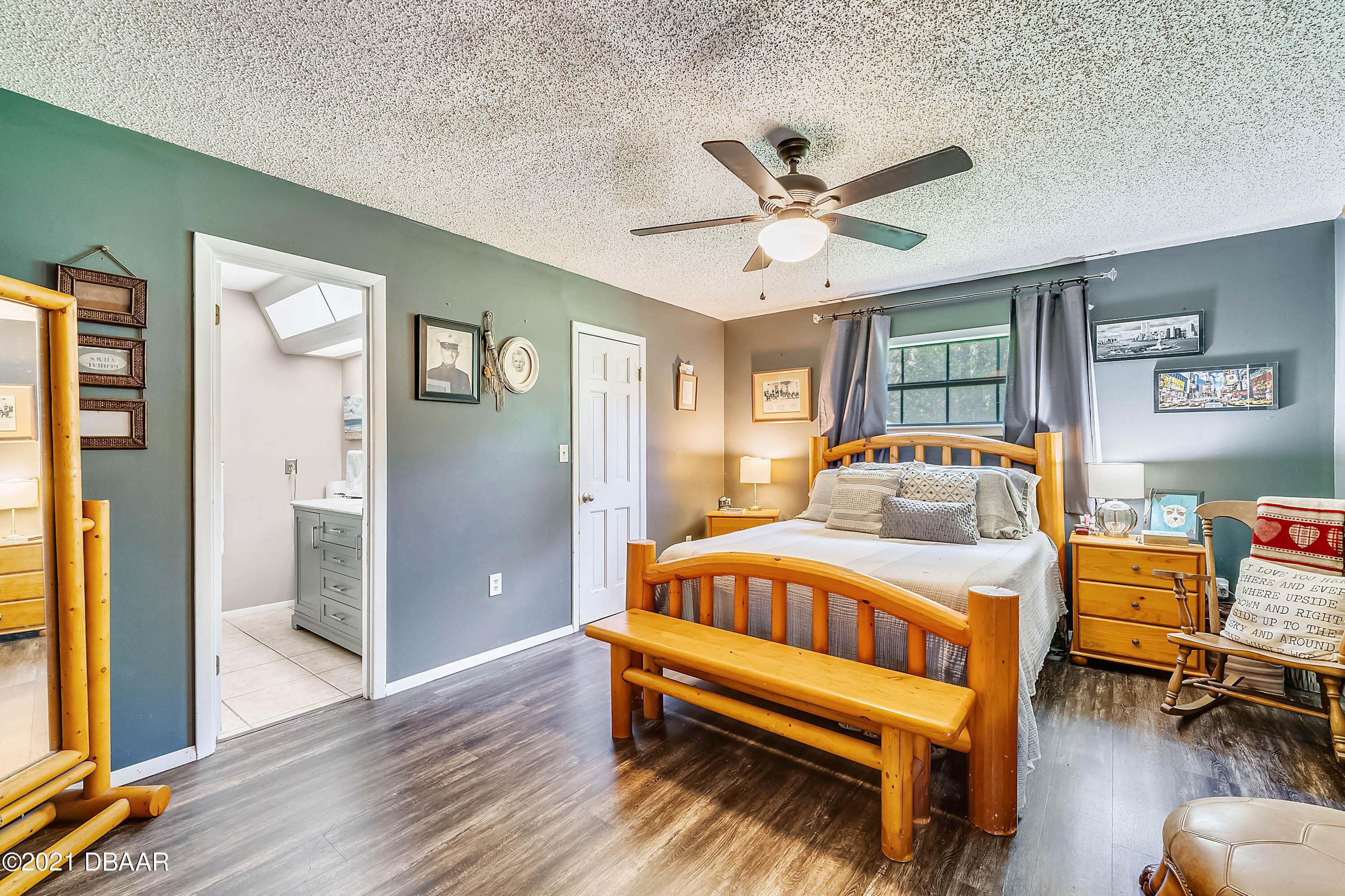 2815 Concord Road DeLand, FL 32720 - Photo 23 of 29 a bedroom with a bed and wooden floor