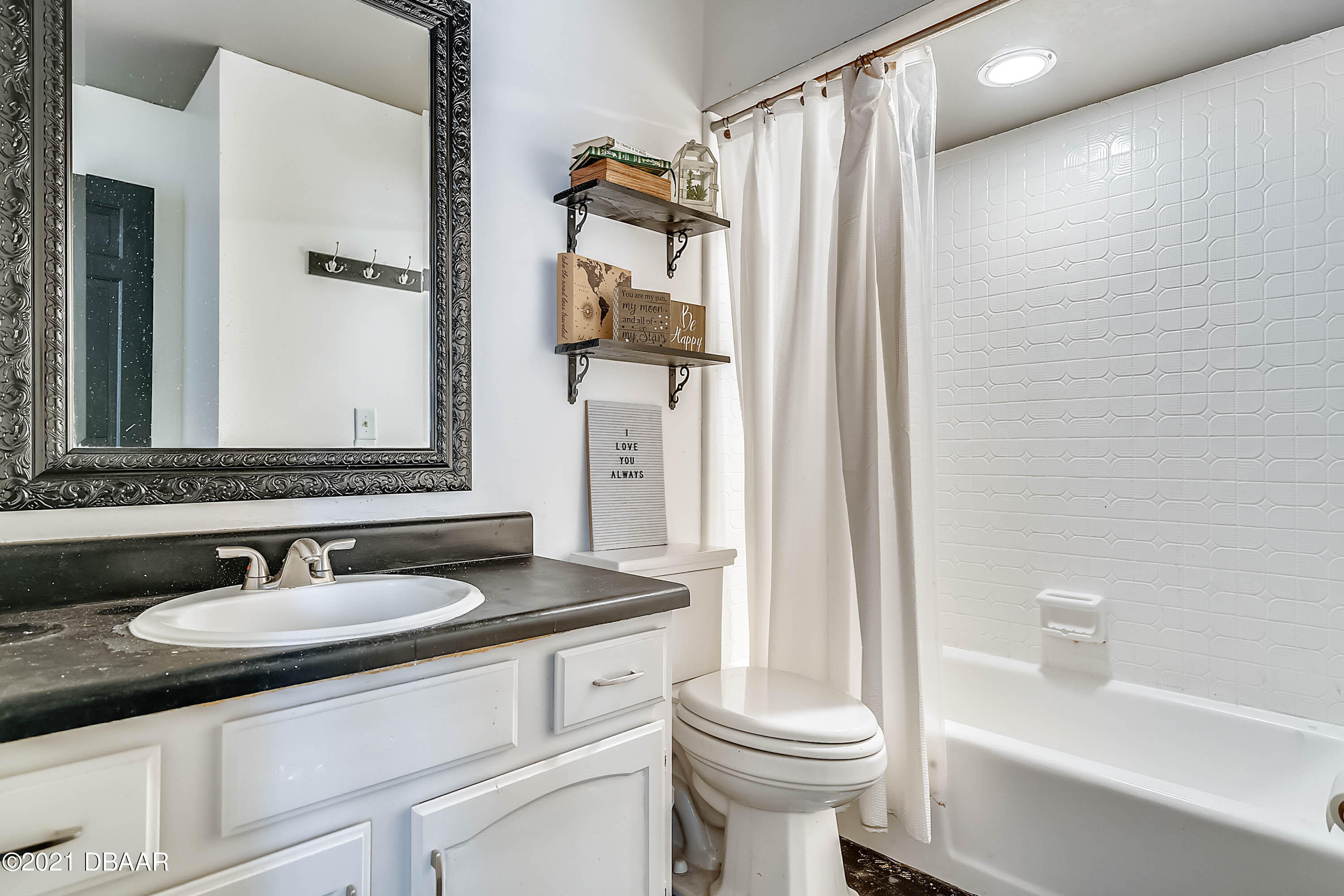 2815 Concord Road DeLand, FL 32720 - Photo 24 of 29 a bathroom with a sink toilet and shower