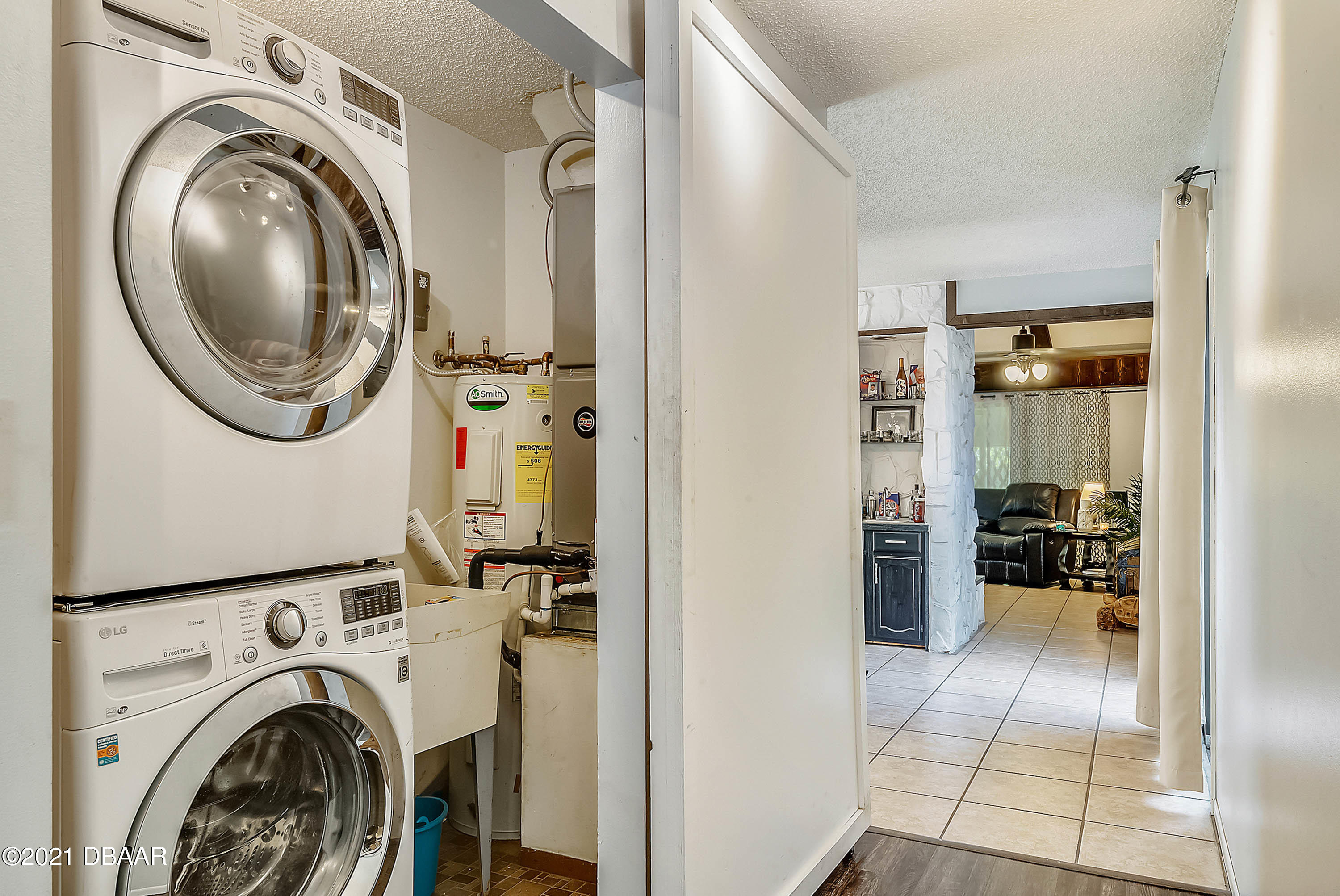 2815 Concord Road DeLand, FL 32720 - Photo 25 of 29 a view of a hallway with washer and dryer