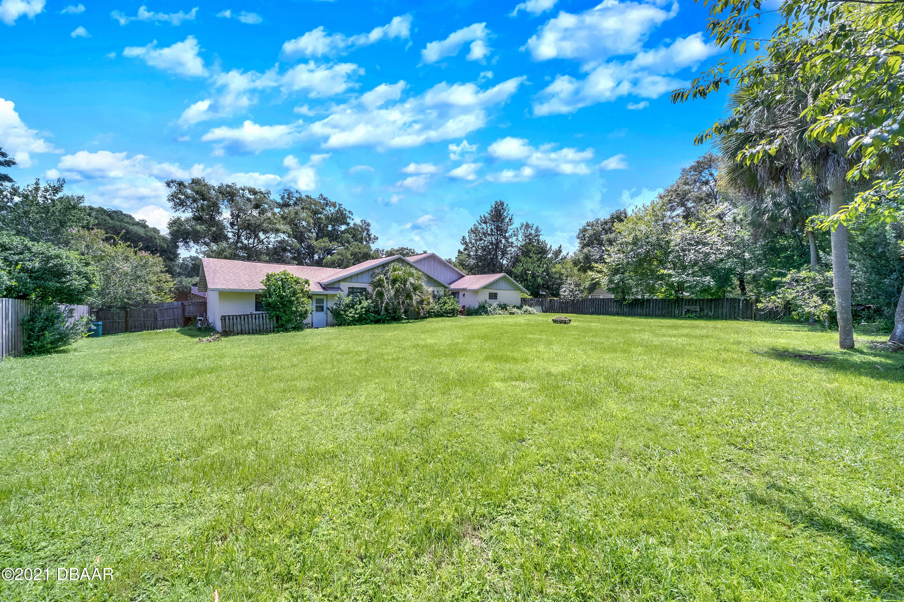 2815 Concord Road DeLand, FL 32720 - Photo 28 of 29 a view of a green field with wooden fence