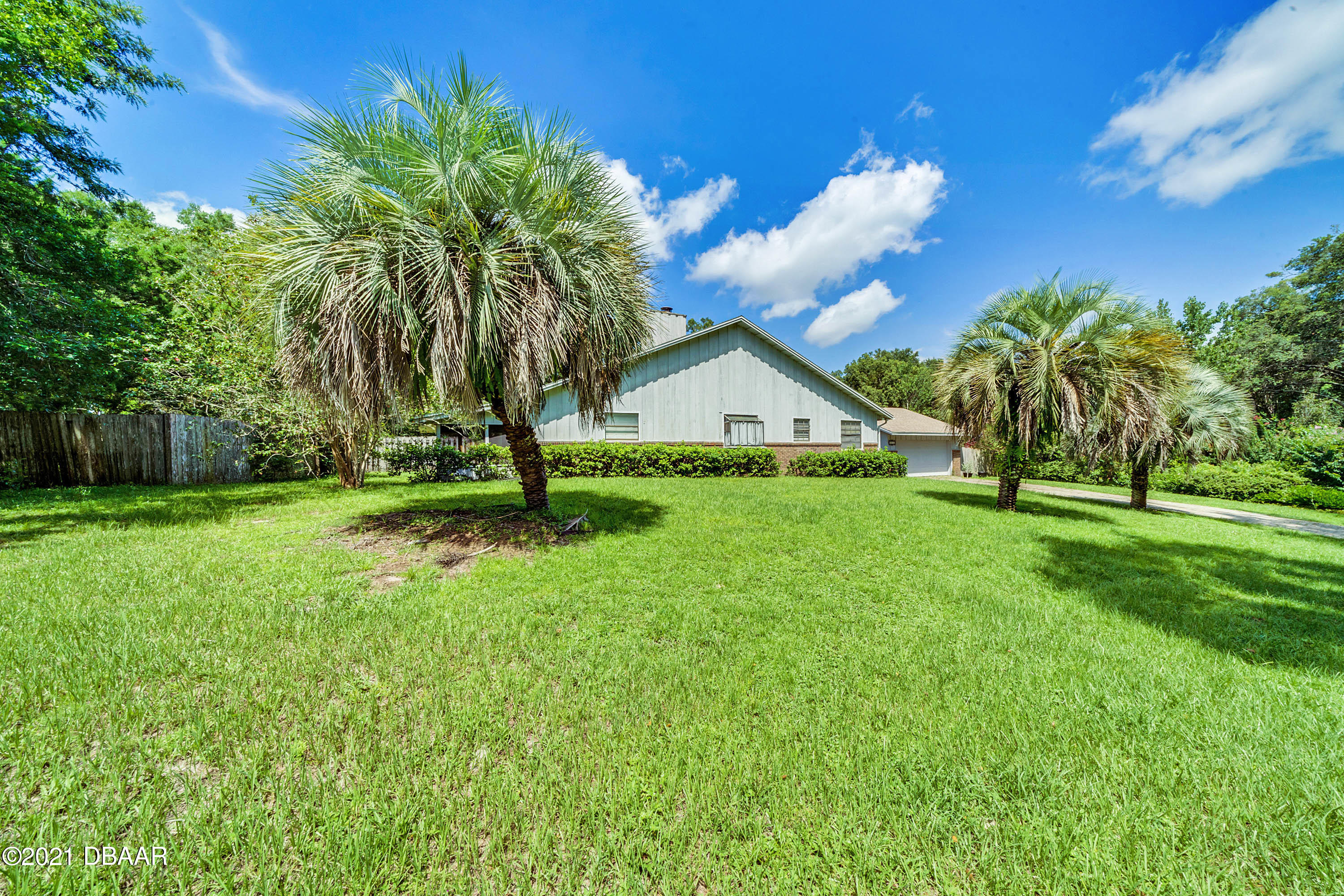 2815 Concord Road DeLand, FL 32720 - Photo 3 of 29 a view of house with backyard and garden