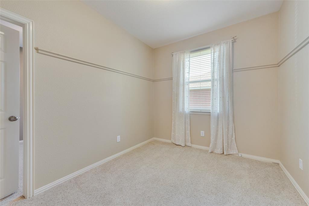 4512 Shade Tree Court Sachse, TX 75048 - Photo 15 of 19 a view of an empty room with closet and a window
