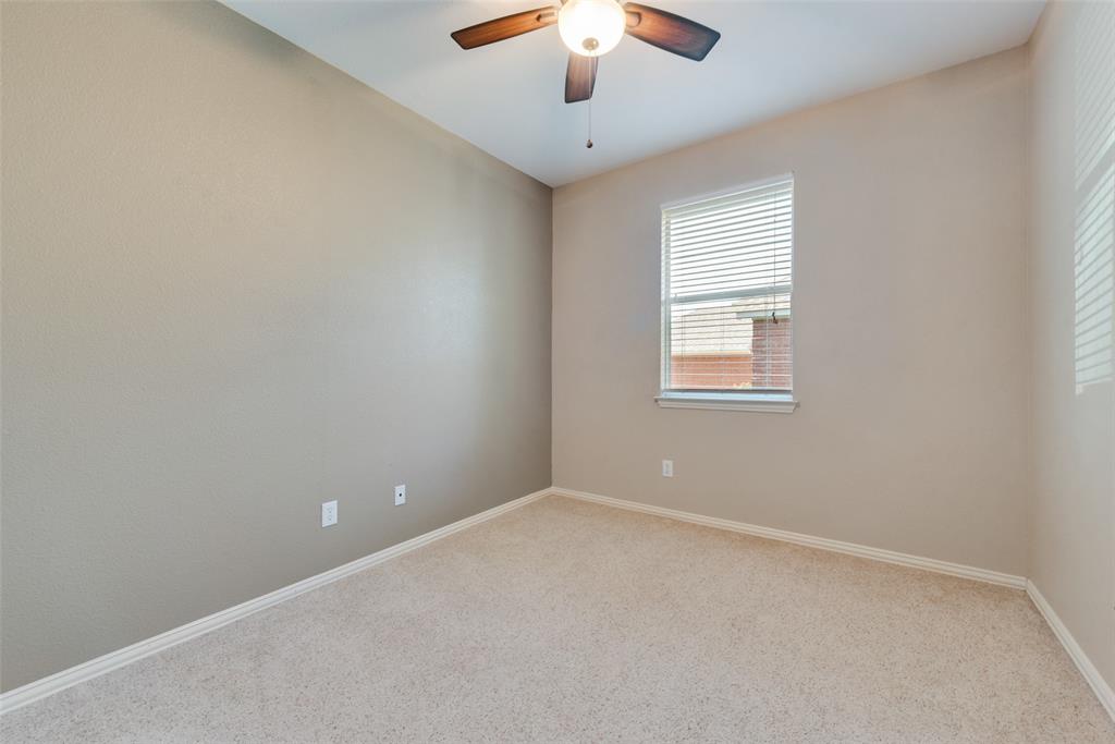 4512 Shade Tree Court Sachse, TX 75048 - Photo 16 of 19 an empty room with a chandelier fan