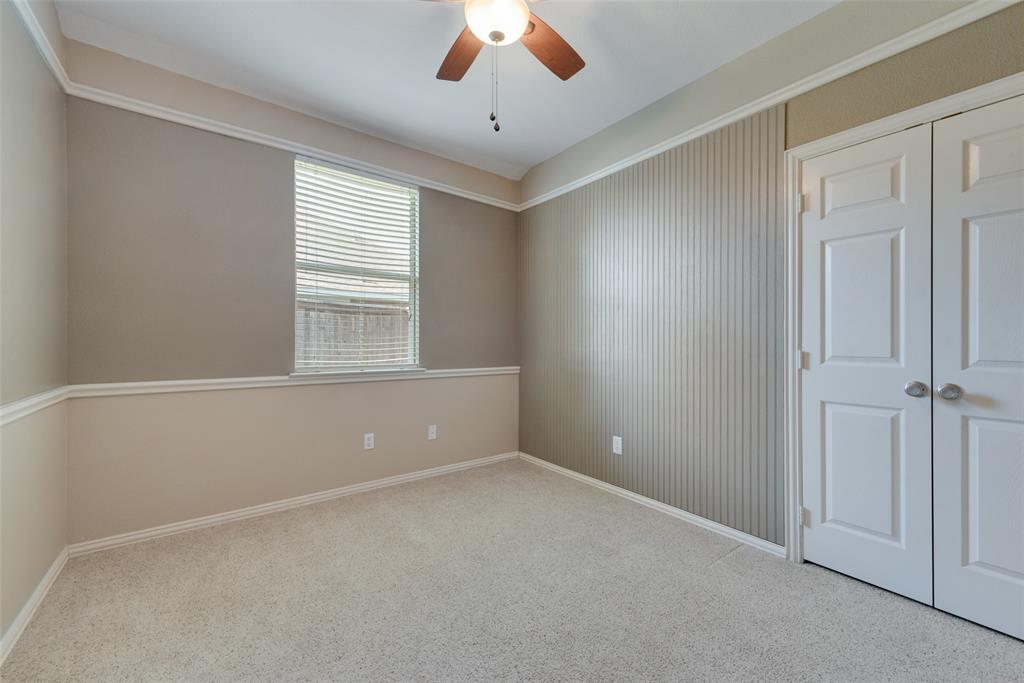 4512 Shade Tree Court Sachse, TX 75048 - Photo 17 of 19 a view of an empty room with a window