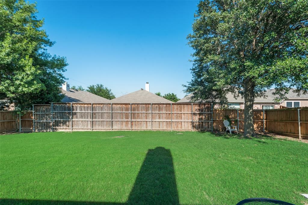 4512 Shade Tree Court Sachse, TX 75048 - Photo 18 of 19 a view of a house with a yard and sitting area
