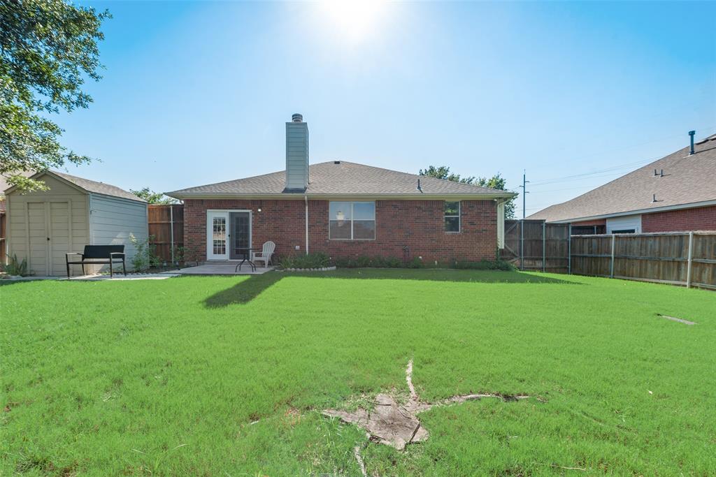 4512 Shade Tree Court Sachse, TX 75048 - Photo 19 of 19 a front view of a house with a yard