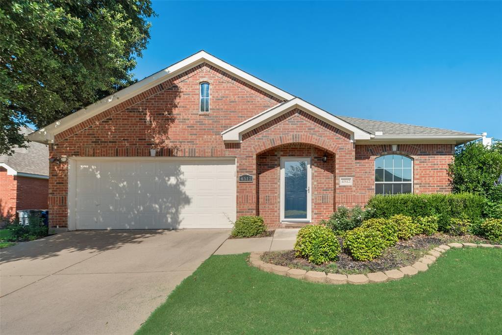 4512 Shade Tree Court Sachse, TX 75048 - Photo 2 of 19 a front view of a house with a yard