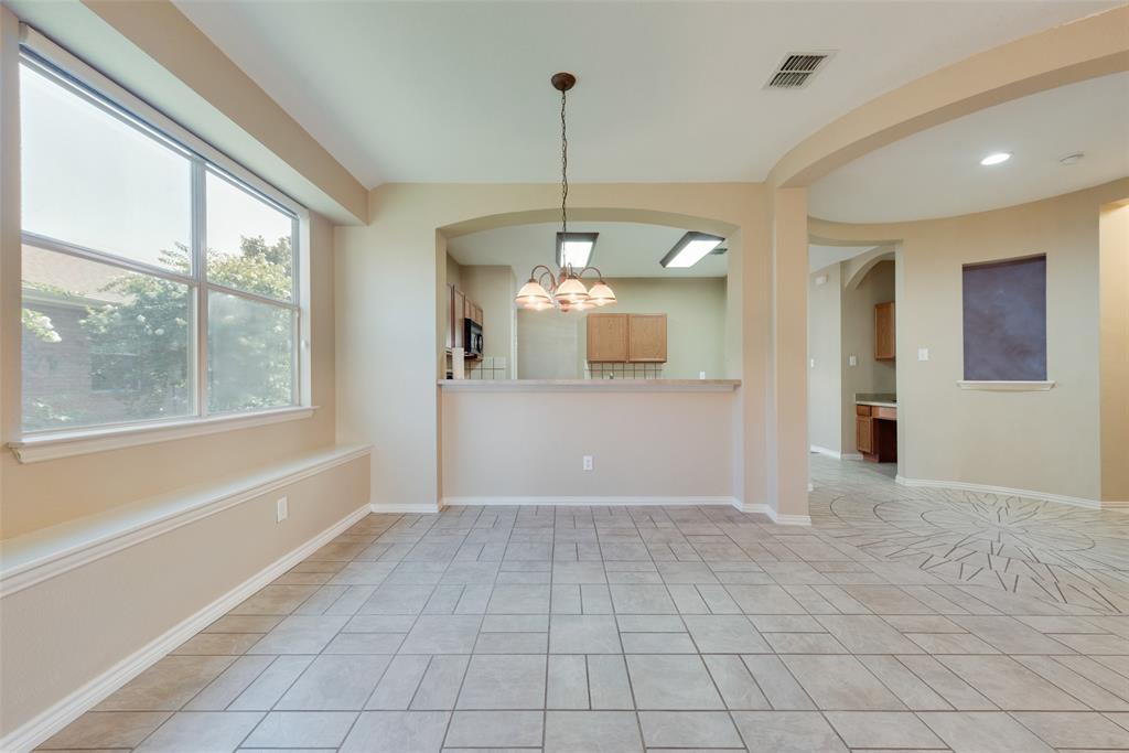 4512 Shade Tree Court Sachse, TX 75048 - Photo 5 of 19 a view of a kitchen with a sink and window