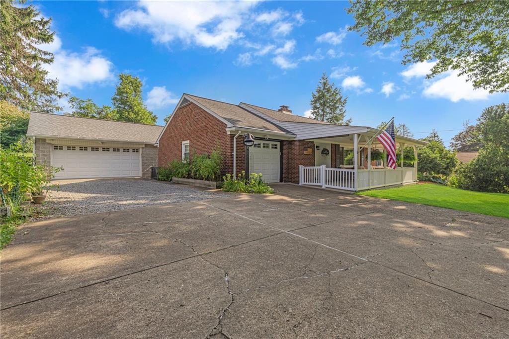 2850 Dutch Ridge Road Beaver, PA 15009 - Photo 29 of 31 a front view of a house with a yard and potted plants