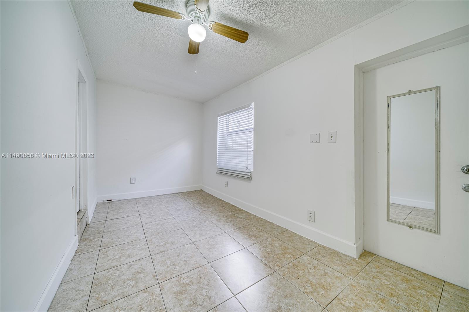 6534 Southwest 34th Street, Unit 2 Miami, FL 33155 - Photo 12 of 20 a view of an empty room with a window