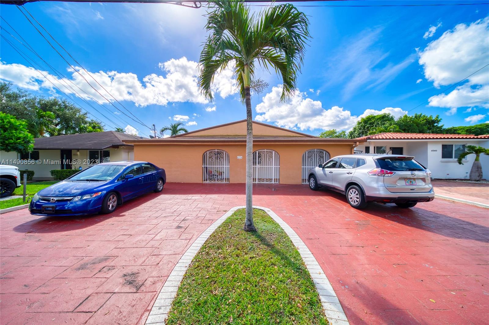 6534 Southwest 34th Street, Unit 2 Miami, FL 33155 - Photo 2 of 20 a view of a car park in front of a house