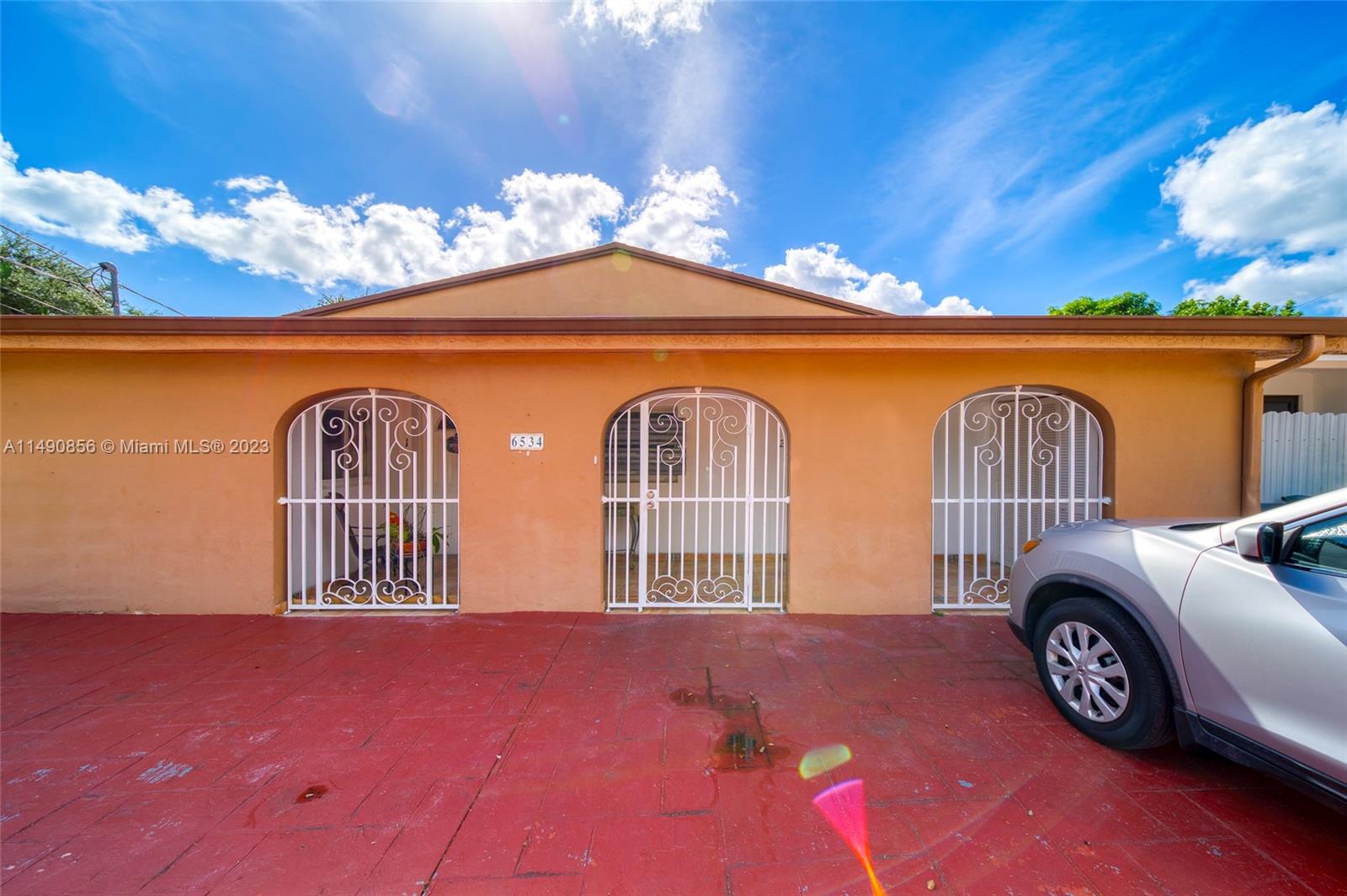 6534 Southwest 34th Street, Unit 2 Miami, FL 33155 - Photo 4 of 20 a front view of a house with parking space