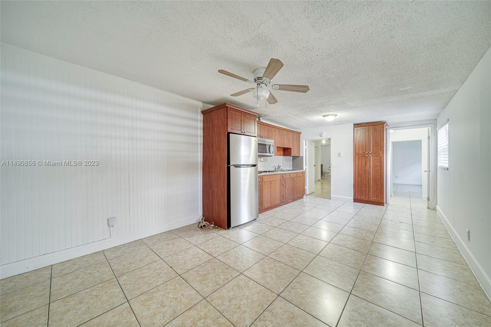 6534 Southwest 34th Street, Unit 2 Miami, FL 33155 - Photo 7 of 20 a view of a kitchen with a sink and a refrigerator