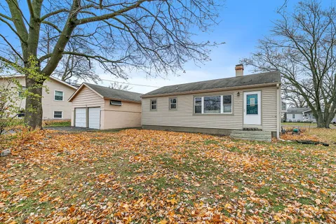 a backyard of a house with large trees
