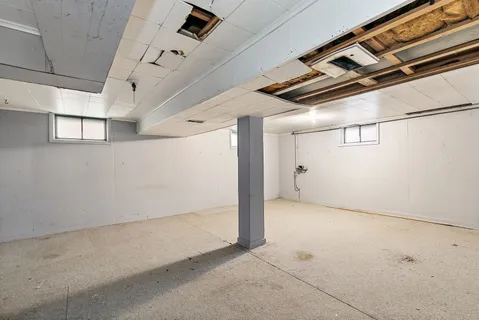 a view of a wooden house and a yard