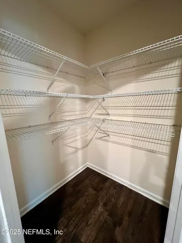 a view of an empty walk in closet