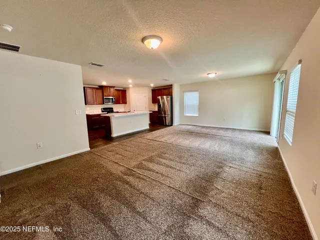 a room with a bed and furniture in it