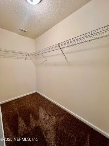 a view of a room with racks on the wall