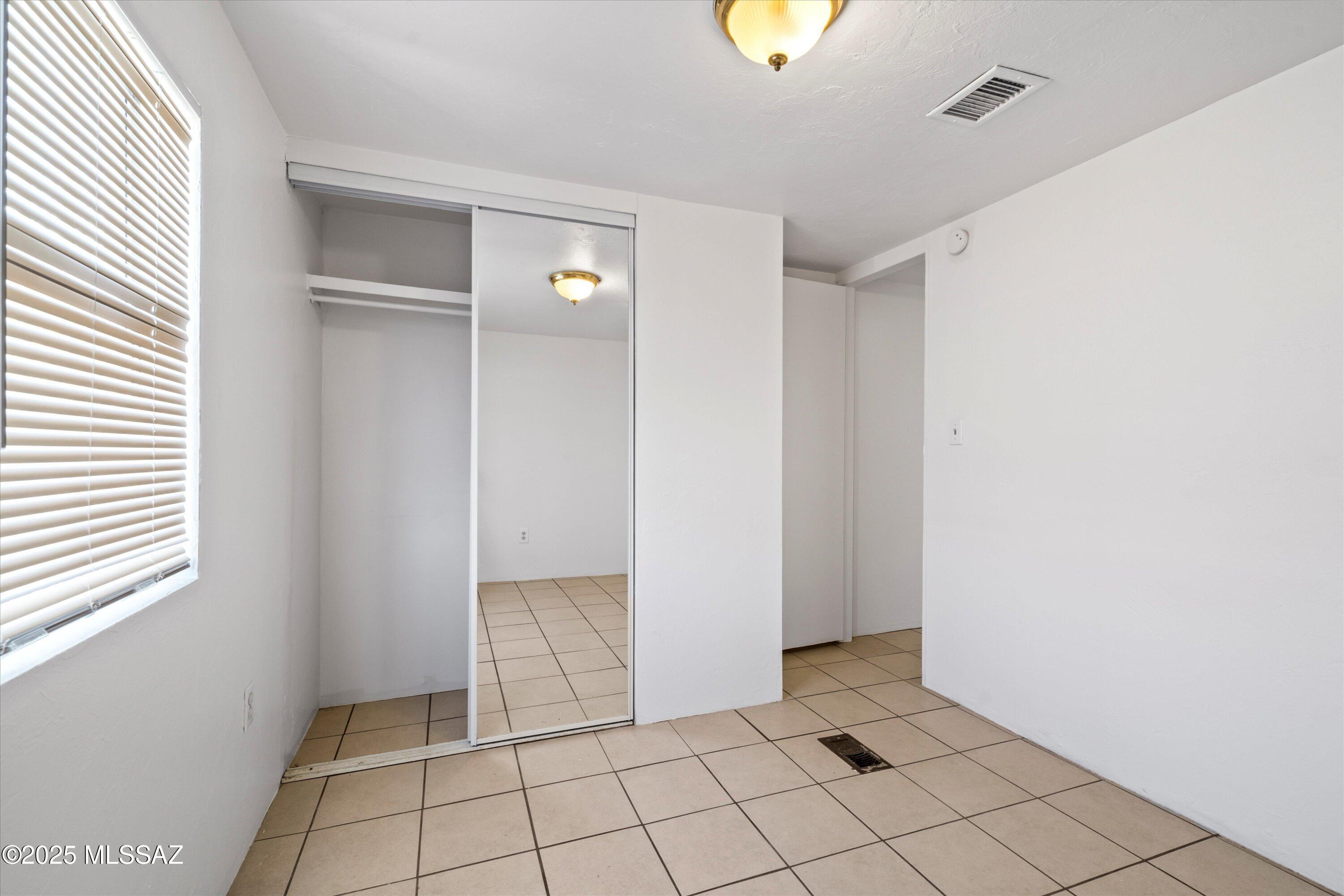 1227 East Ginter Road Tucson, AZ 85706 - Photo 16 of 18 a view of an empty room and window
