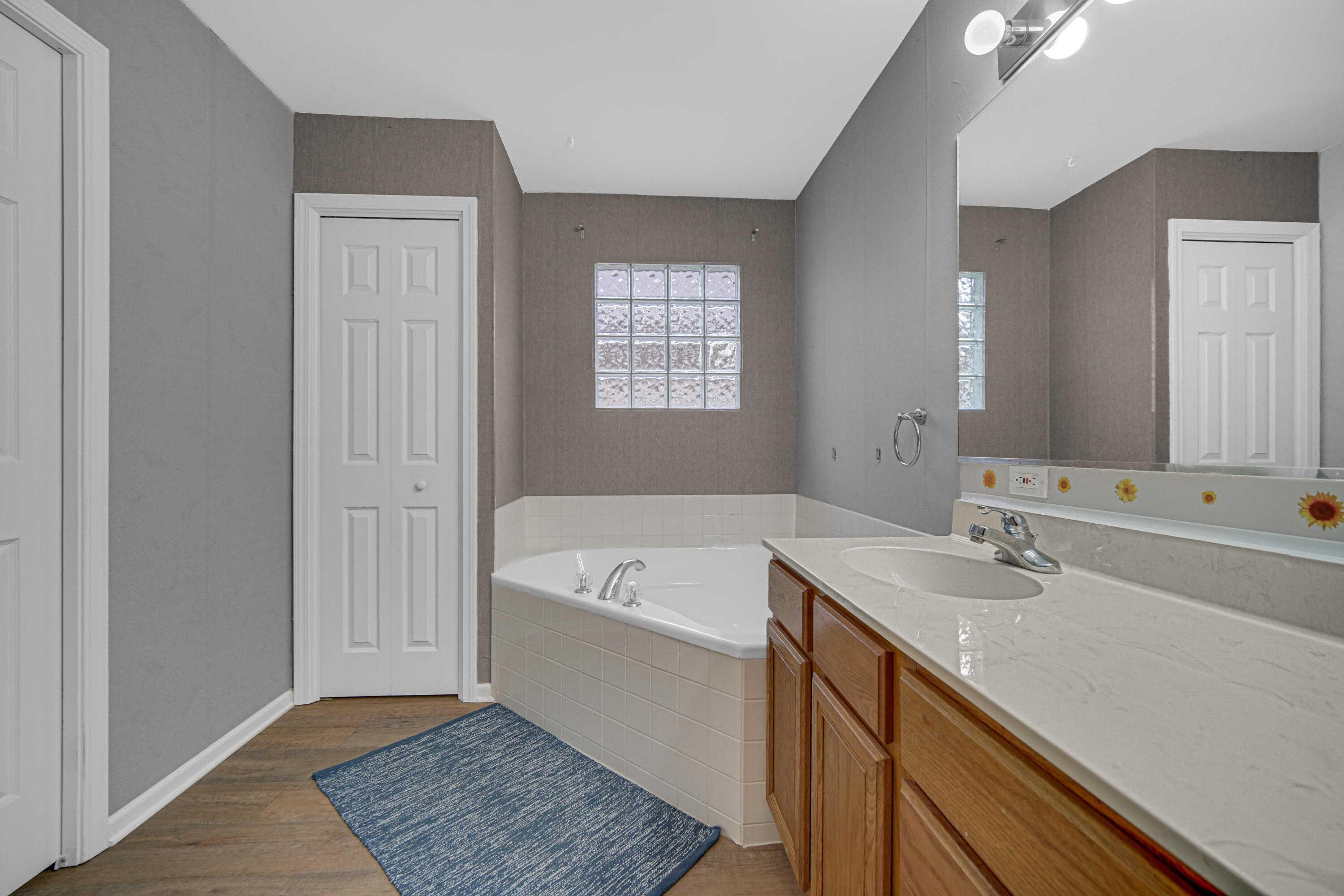 11130 Allendale Court Crown Point, IN 46307 - Photo 17 of 21 a bathroom with a tub a sink and mirror