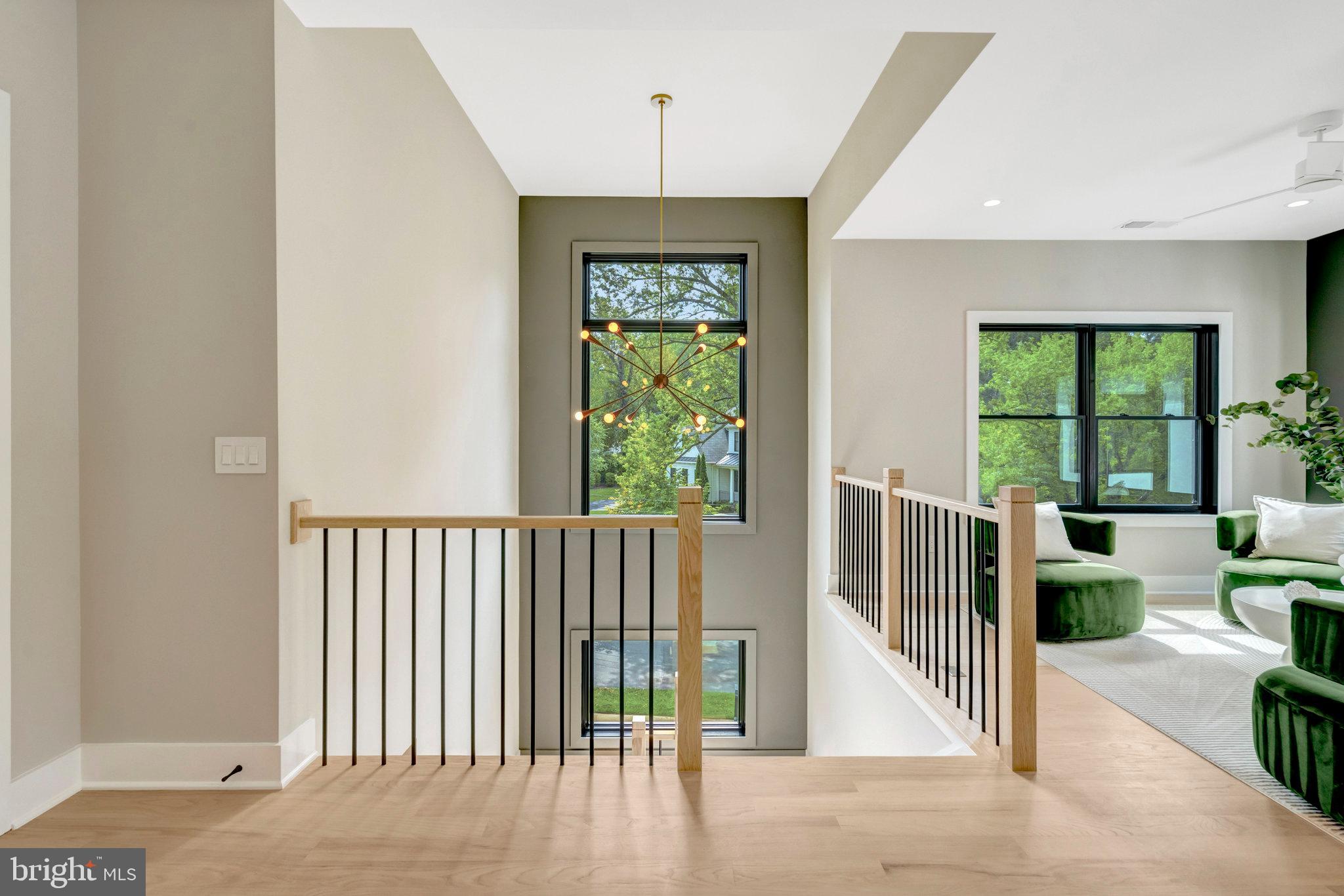 7400 Churchill Road McLean, VA 22101 - Photo 46 of 119 elegant chandelier by the stairs