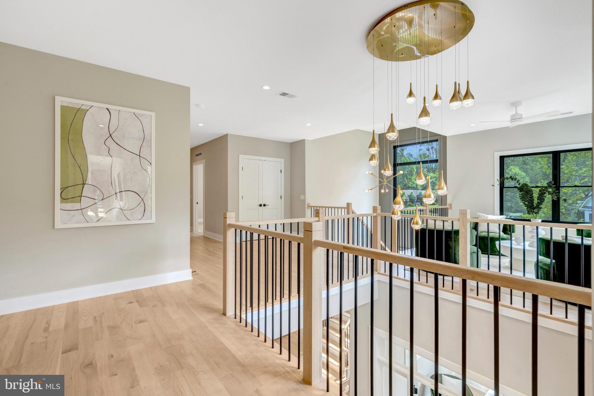 7400 Churchill Road McLean, VA 22101 - Photo 49 of 119 elegant chandelier by the stairs