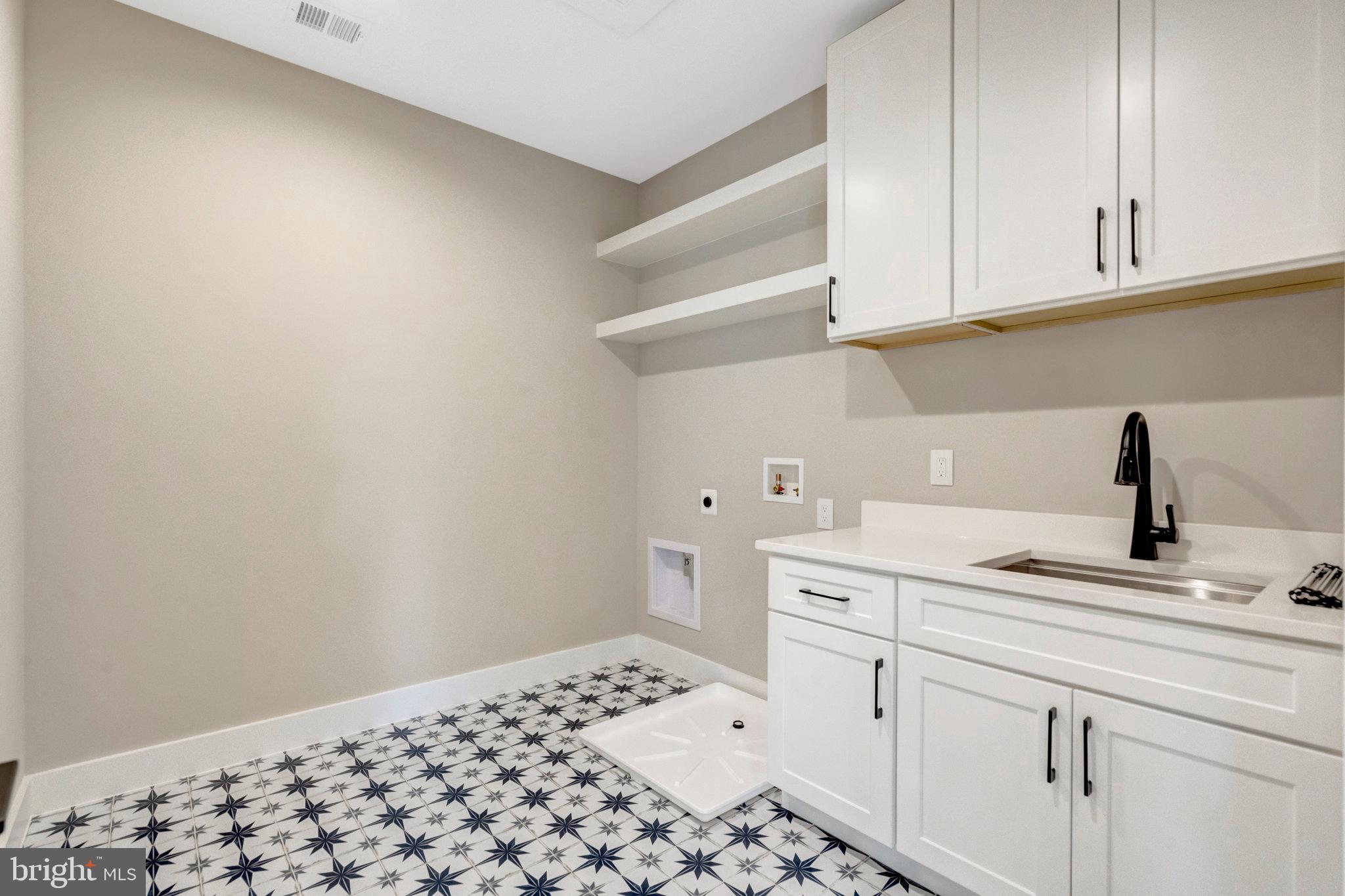 7400 Churchill Road McLean, VA 22101 - Photo 89 of 119 Ceramic tile flooring at laundry room