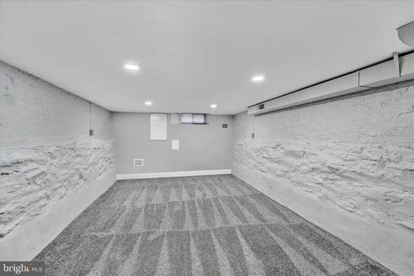 a view of an empty room with stairs