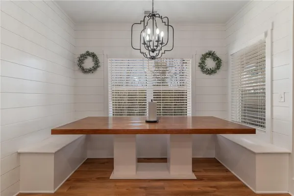a view of a balcony dining area with furniture window
