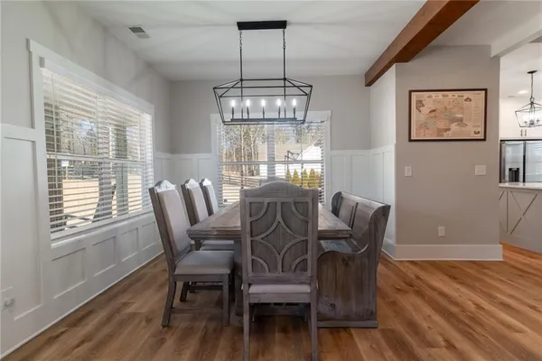 a bathroom with a tub and a window