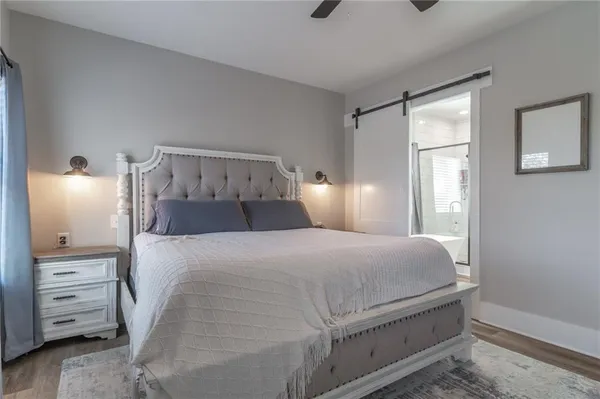 a white toilet sitting in a bathroom next to a window
