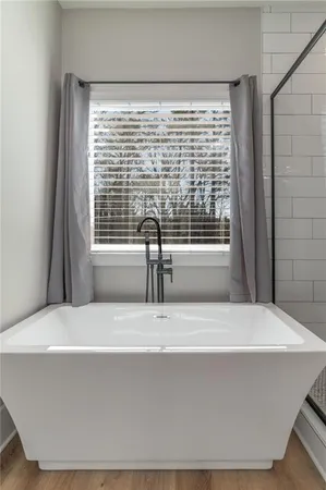 a kitchen with stainless steel appliances granite countertop a sink and a stove